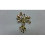 A hallmarked 9ct gold pearl and diamond brooch 4 x 3cm approx 4.4gs in generally good condition