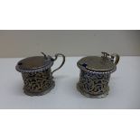 A pair of silver mustards. London 1897/98. Maker WG JL. Silver weight approx 6.5 troy oz both