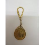 A 1906 Liberty American 10 dollar 22ct gold coin in a 9ct gold keyring mount, total weight approx