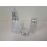 A silver top shaker, 17cm tall, a silver rim salt and a silver top sifter, all good condition