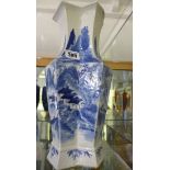 A Chinese 19th century blue and white octagonal vase decorated with a mountain scene and poem.
