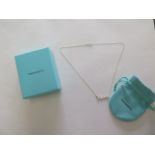 A Tiffany and Co silver olive leaf pendant necklace with box and bag, in good condition