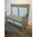A painted pine hall bench with a lift up seat, 98cm tall x 95cm x 49cm
