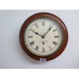 An 8 day spring driven 8" dial wall clock, 27cm diameter, running in saleroom