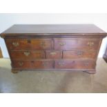 A Georgian oak mule chest with a rising top and 2 top dummy drawers above 5 drawers, 160cm wide x