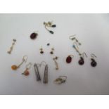 A selection of assorted earrings including 9ct, silver and a small emerald