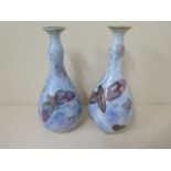 A pair of Carlton Armand lustre bottle vases, 22cm tall, both in good condition