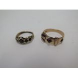 A 10ct belt ring and a 9ct ring, sizes W and L, approx 7.4grams, some usage but generally good