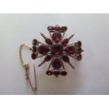 A gilt metal cross pendant brooch, 3.5cm wide, approx 12.4grams, in generally good condition, pin