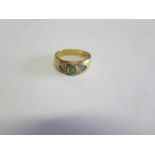 An 18ct yellow gold emerald and diamond ring, size M/N, approx 5.4grams, generally good with some