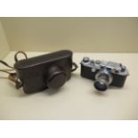 A Leica Ernst leitz Wetzlar 35mm camera, number 254263 with a Summar f=5cm 1:2 lens no:389449,