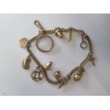 A 9ct yellow gold charm bracelet, total weight approx 34grams
