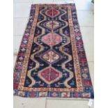 A hand knotted woollen Ardabil rug, 2.45m x 1.45m