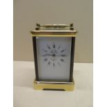 A good quality French 20th century carriage clock, striking on one gong, 15cm tall, with handle