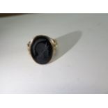 A hallmarked 9ct Itaglio ring, size T, approx 7.4grams, some small abrasions but generally good