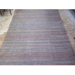 A hand knitted woollen shiraz kilim rug, 305cm x 200cm, in good condition