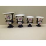 A graduated set of four 19th century English porcelain vases, of two handled urn form, decorated