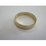 A hallmarked 18ct yellow gold band ring, size Q, approx 4.6 grams, some small usage marks but