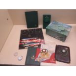 A collection of Rolex items to include 3 various wallets, a travel pouch, 2 Rolex watch tags,