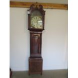 A good flame mahogany 8 day longcase clock with an arched 13 inch painted dial, signed Archbold