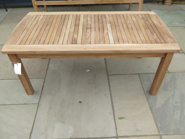 A boxed teak coffee table, new and boxed, 120cm x 60cm