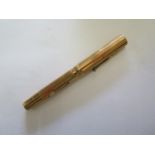 A ladies Watermans 14ct gold cased fountain pen, 11cm long, generally good plunger moves but sack