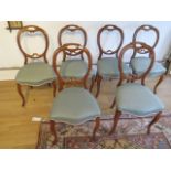 A set of six 19th century walnut balloon back dining chairs on cabriole legs, in good condition