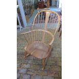 An Ercol light elm rocking chair in good condition