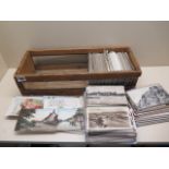 A box containing approx 200 postcards, many topographical for Cambridgeshire, Bedfordshire and
