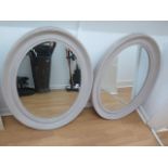 A pair of painted oval mirrors, 67cm x 86cm in good condition