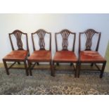 A set of 4 Georgian mahogany dining chairs with vase shaped splats