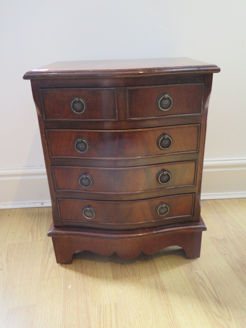 A small bowfront chest of four drawers,, 53cm tall x 42cm x 33cm