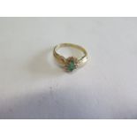 A 14ct yellow gold emerald and diamond ring, size O, approx 2.4grams, marked 14ct, generally good