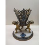 A gilt metal champleve enamel centrepiece stand with 3 cherubs on a marble base, 24cm tall x 22cm