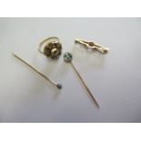 A yellow gold ring, size M, tests to approx 18ct, approx 5.7grams, a 9ct gold brooch approx 1.3grams