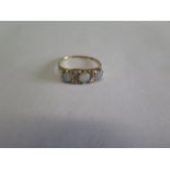 A gold opal and diamond ring, tests to approx 18ct, ring size O, approx 2.8grams, some general