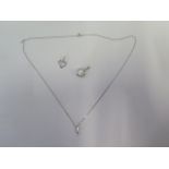 A 9ct white gold pendant on chain, a white gold pendant, approx 1.3grams and a 14ct pearl pendant,