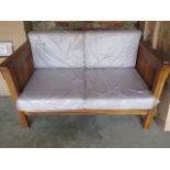 A new garden bench with back and seat cushions