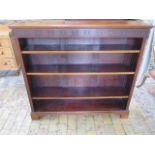A mahogany open bookcase with 3 adjustable shelves, 111cm tall x 122cm x 28cm