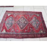 A hand knotted woollen Luri rug, 2.05m x 1.46m