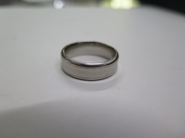 A Palladium band ring marked pd, size U, approx 9.5 grams, some usage but generally good condition