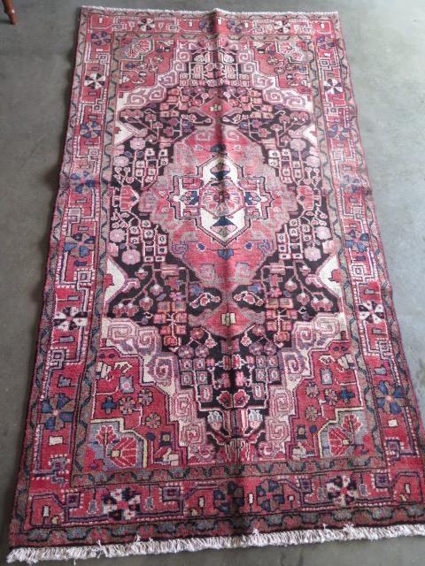 A hand knotted Hamadan rug. Size 2.26m x 1.2m