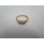 An 18ct yellow gold diamond trilogy ring, centre stone approx 20pts, ring size K/L, in good