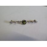 A diamond and peridot yellow gold brooch tests to approx 9ct, 4.5cm long, approx 4grams generally