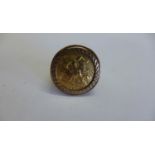 An Elizabeth II half gold sovereign ring, dated 1982, in a 9ct gold ring mount, size O, total weight