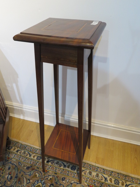 An Edwardian mahogany plant stand, 96cm high