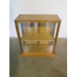 A 1950s display cabinet in polished condition, 62cm tall x 59cm x 28cm