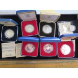 Six boxed silver proof crowns, total 257grams, and a silver proof £1 coin, 9.5grams