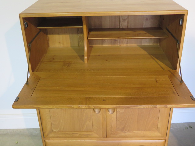 An Ercol blonde elm bureau cabinet with 2 doors and a drawer in good condition, minor scratches to - Image 2 of 3