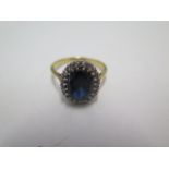 An 18ct yellow gold diamond and dark blue sapphire ring, size R, approx 4.6grams, marked 18ct.